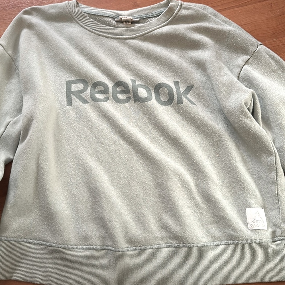 Blueish greenish color Reebok sweater
